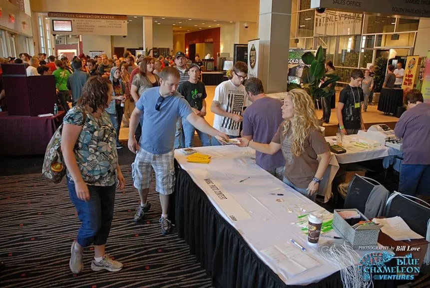 Visitors at the registration tables in the Tinley Park Convention Center lobby