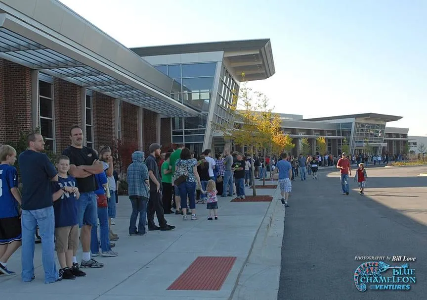 The entry line stretching along the sidewalk outside the Tinley Park Convention Center on a show morning